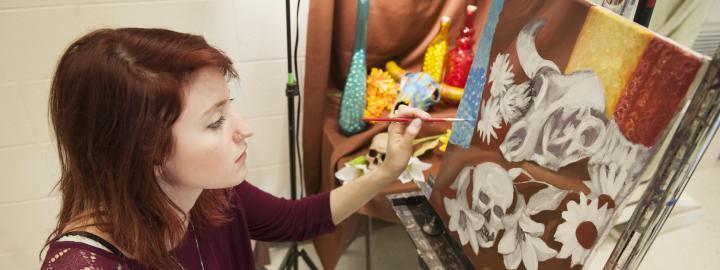 A student working in a painting lab